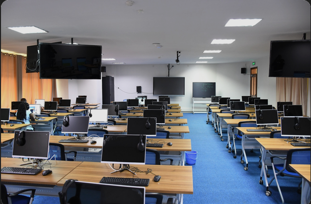 Students learning practical software skills inside the SitechX Academy lab room in Kenya